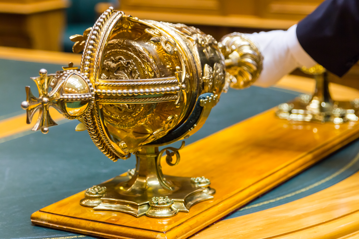 close up of gold detail as mace is placed on the Table of the House